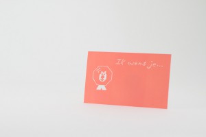 Een klein kaartje met de tekst 'Ik wens je...' en een leeuwtje